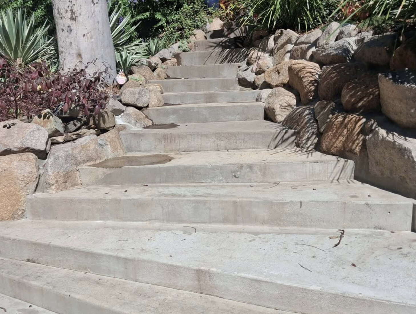 Weathered plain concrete garden steps before resurfacing