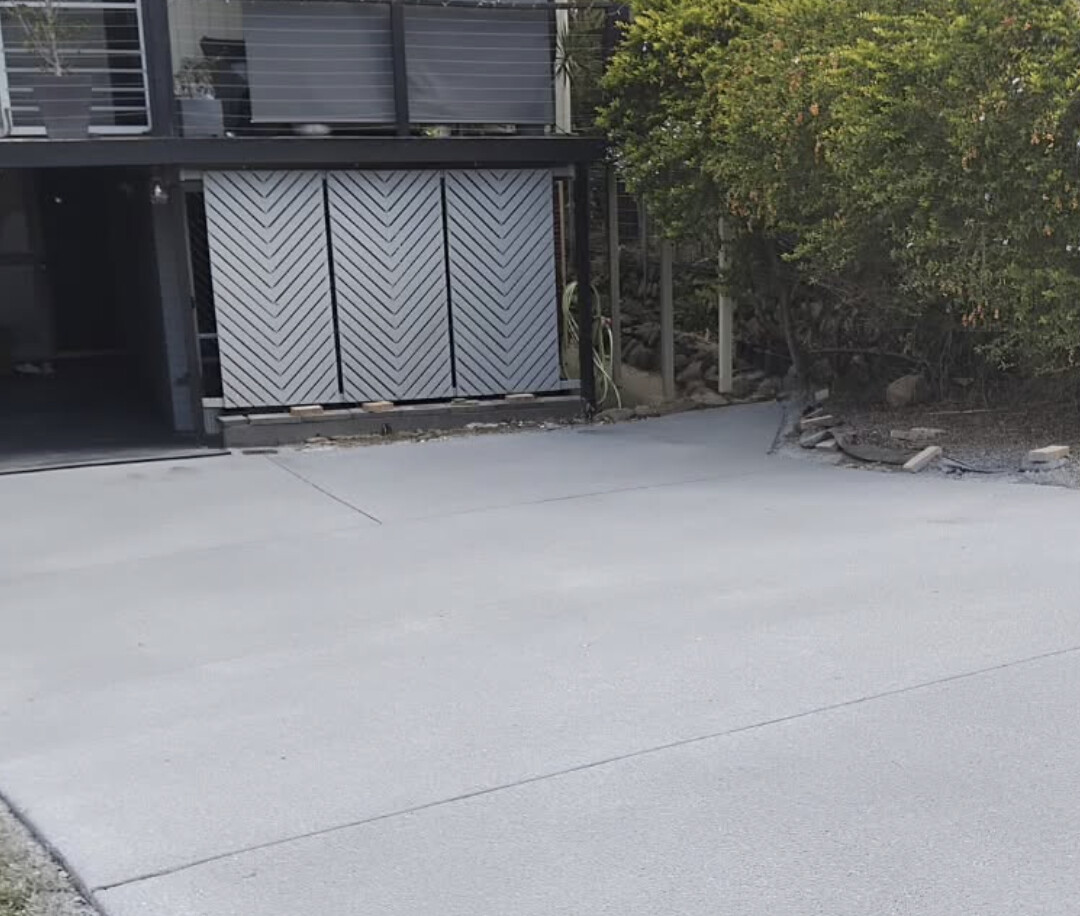 Uniform light grey resurfaced driveway