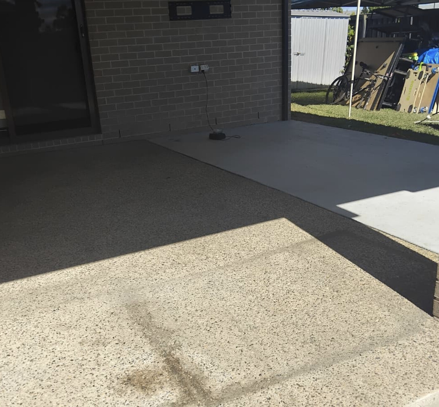 Plain aggregate alfresco area before resurfacing