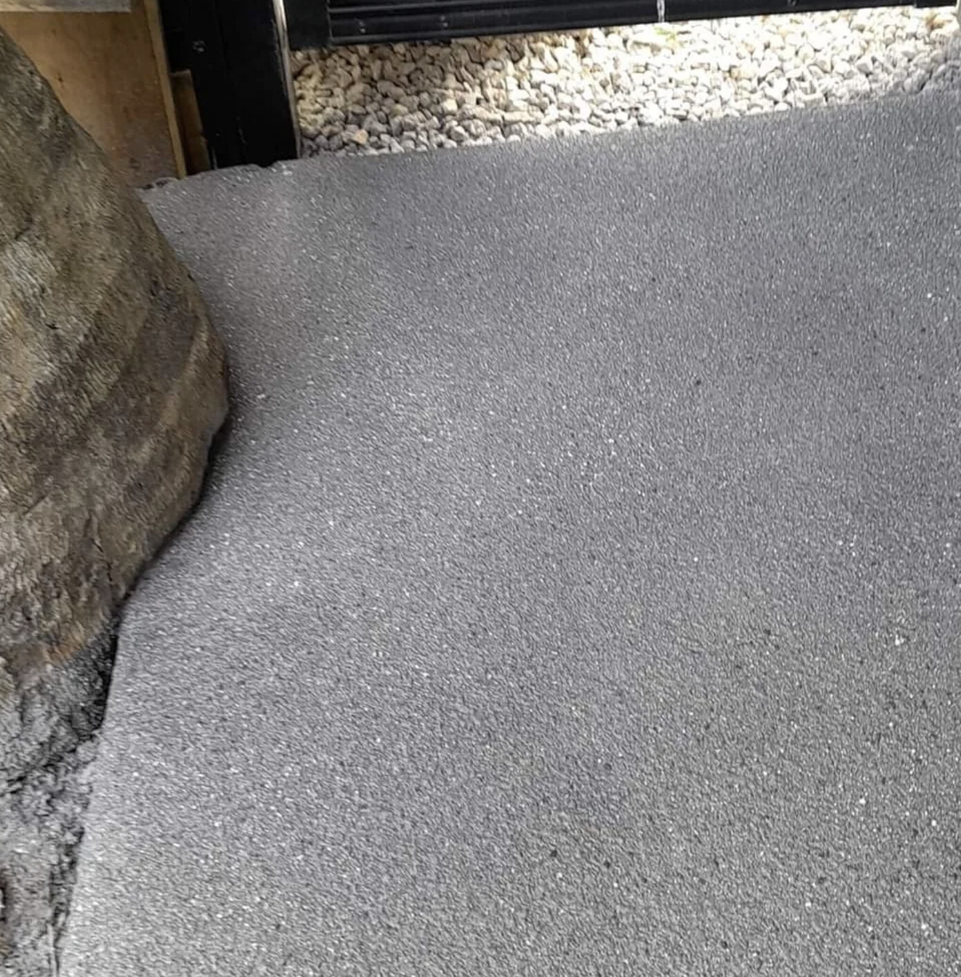 Fresh grey fleck spray-on finish after resurfacing