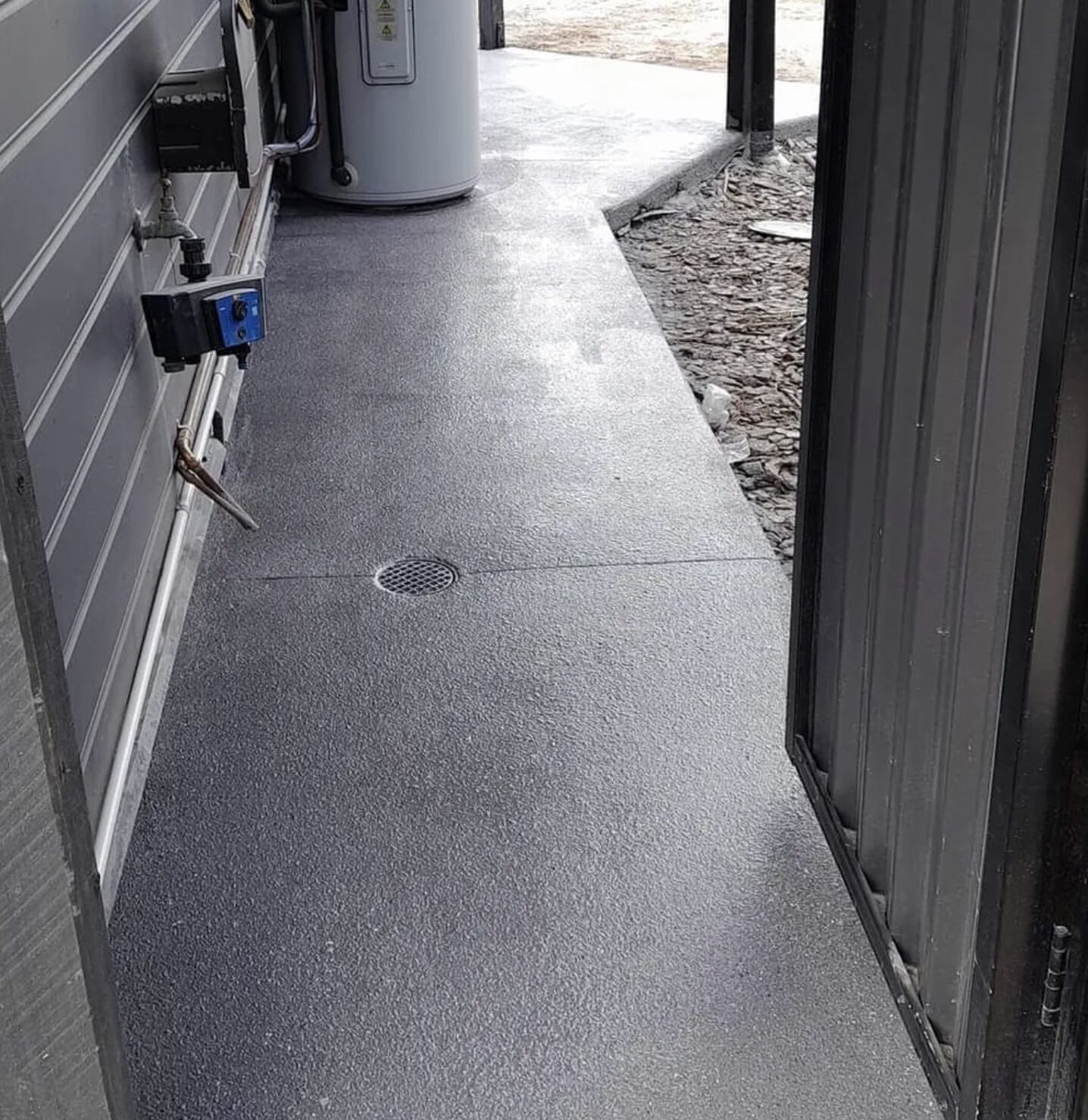 Dark charcoal spray-on side path after resurfacing