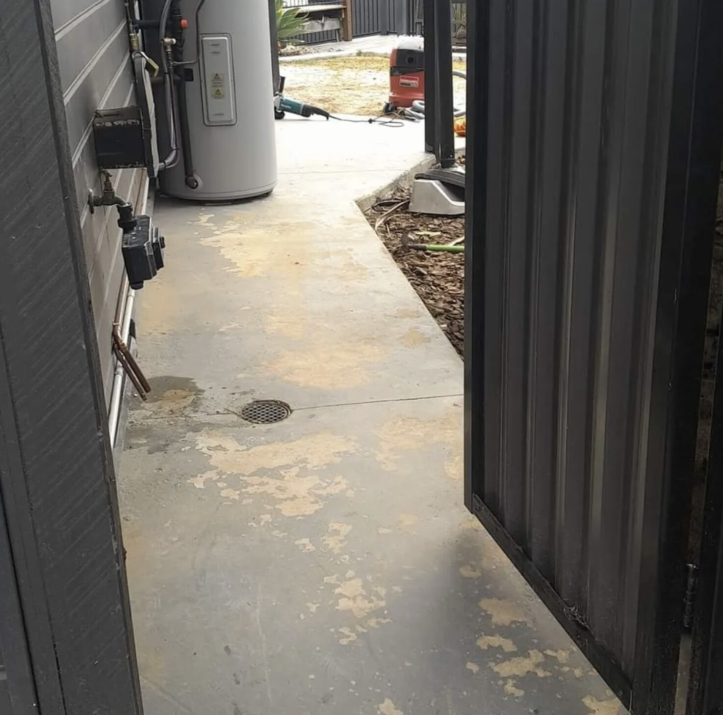 Stained side-path concrete before resurfacing