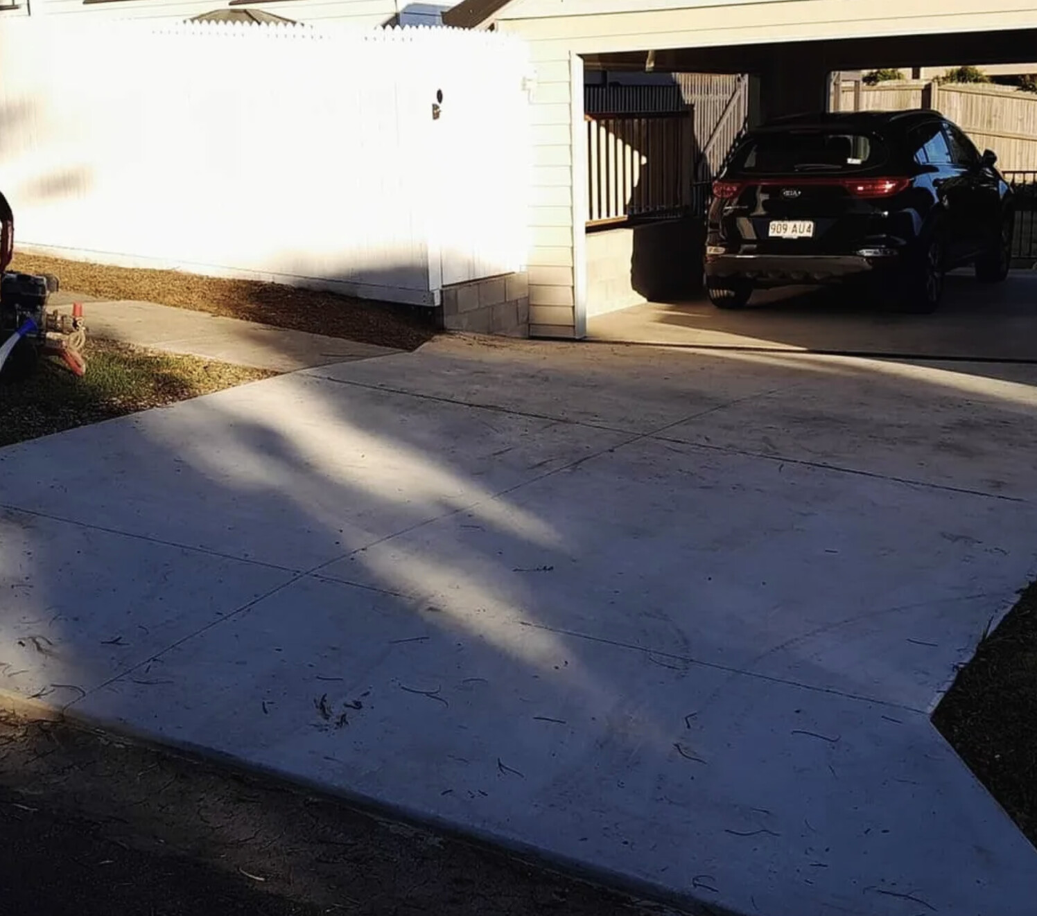 Faded plain concrete driveway before resurfacing